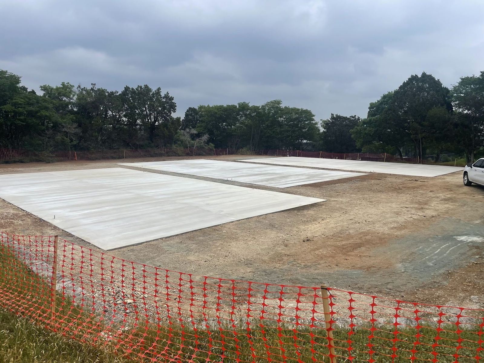 Freshly poured concrete slab on the cleared site